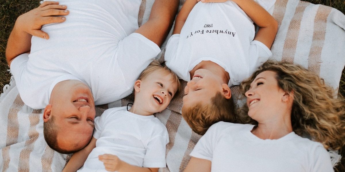 a group of people laying on top of each other